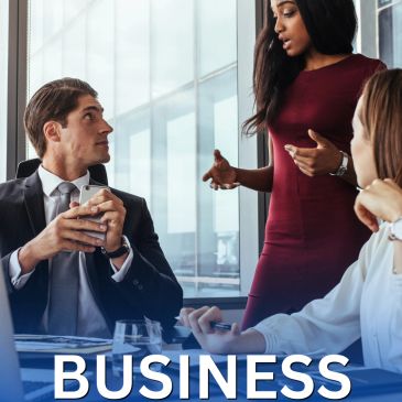 Three professionals having a business discussion in an office.