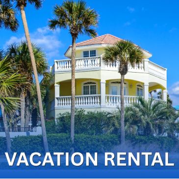 Beachside vacation rental with palm trees.