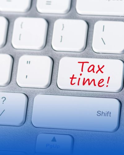 Keyboard with 'Tax time!' on a key.