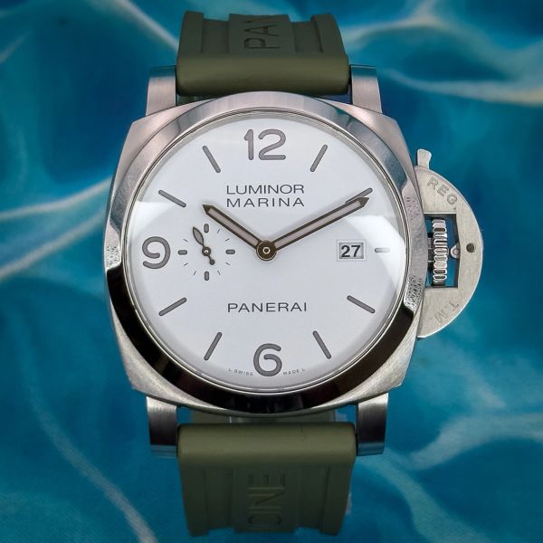 Close-up of a Panerai Luminor Marina wristwatch with a white dial and green strap.