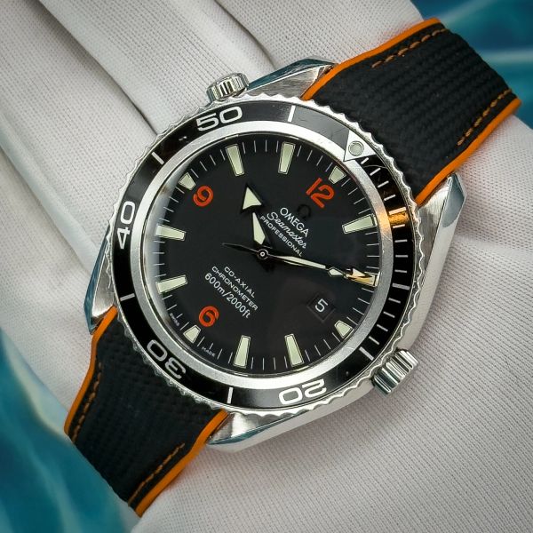 Omega Seamaster Professional watch with orange accents.