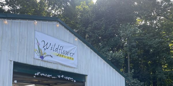 Building face with sign reading Wildflower Studio 