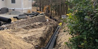 Drainage system installation designed to redirect excess water and reduce erosion.