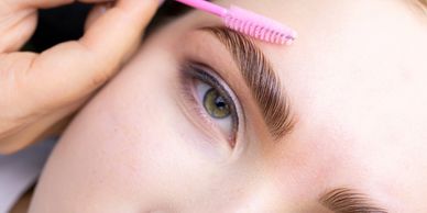 eyebrow lamination treatment being brushed
