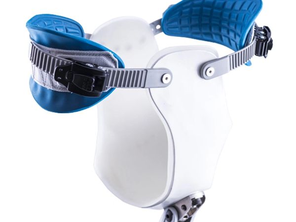 White and blue orthopedic body brace with adjustable straps.