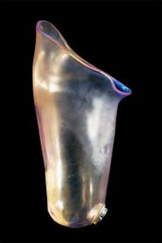 A shiny, metallic, asymmetrical vase with a reflective surface.