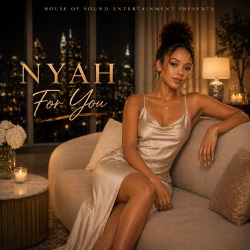 Elegant woman in satin dress on sofa, city lights background.