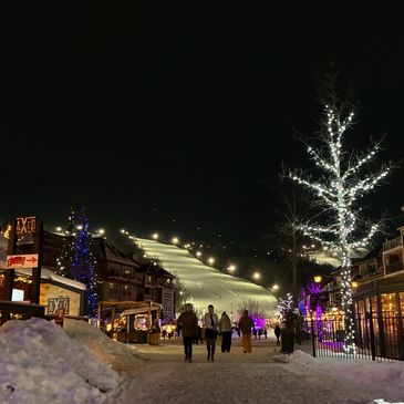 Illuminated ski resort hill at night