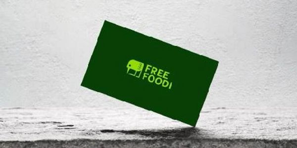 Green card with 'FREE FOOD!' text on a gray surface.