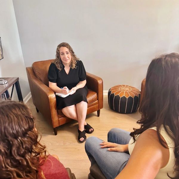 Special Education Advocate Holly Bailey meets with student and parent at her office in Summerville