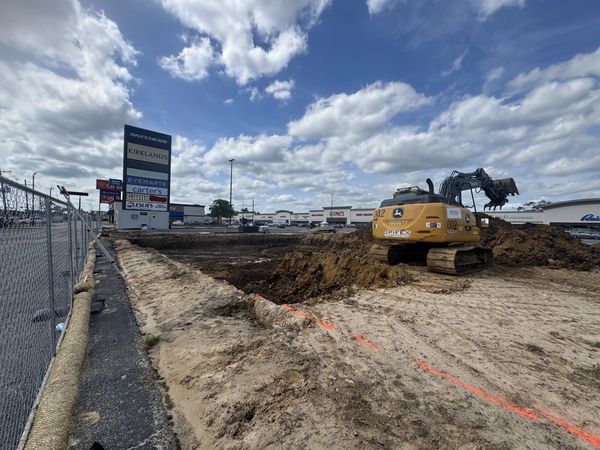 Excavator cutting the building pad at Bubba's 33 in Beaumont, TX
