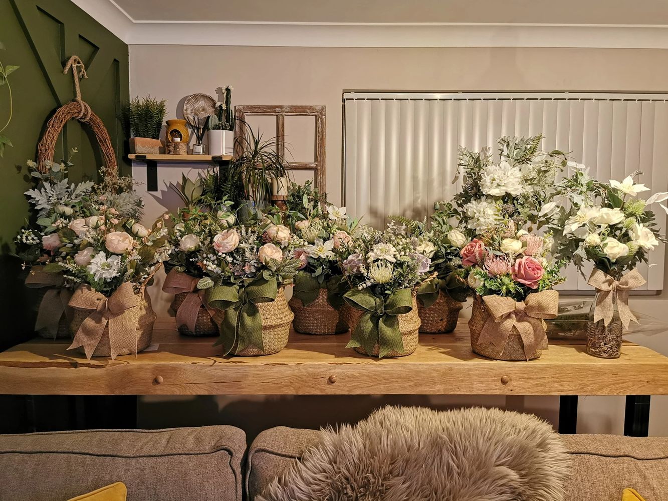 One of our industrial oak breakfast bars being used as a customers flower arranging desk 