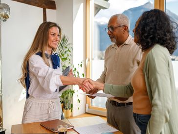 Professional shaking hands with clients.