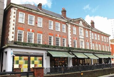 Building with a ground floor restaurant and flats above
