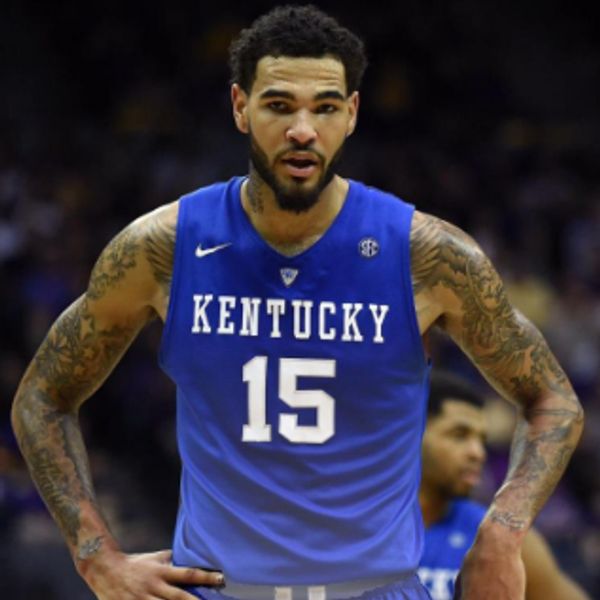 Kentucky basketball player number 15 with tattoos on his arms during a game.