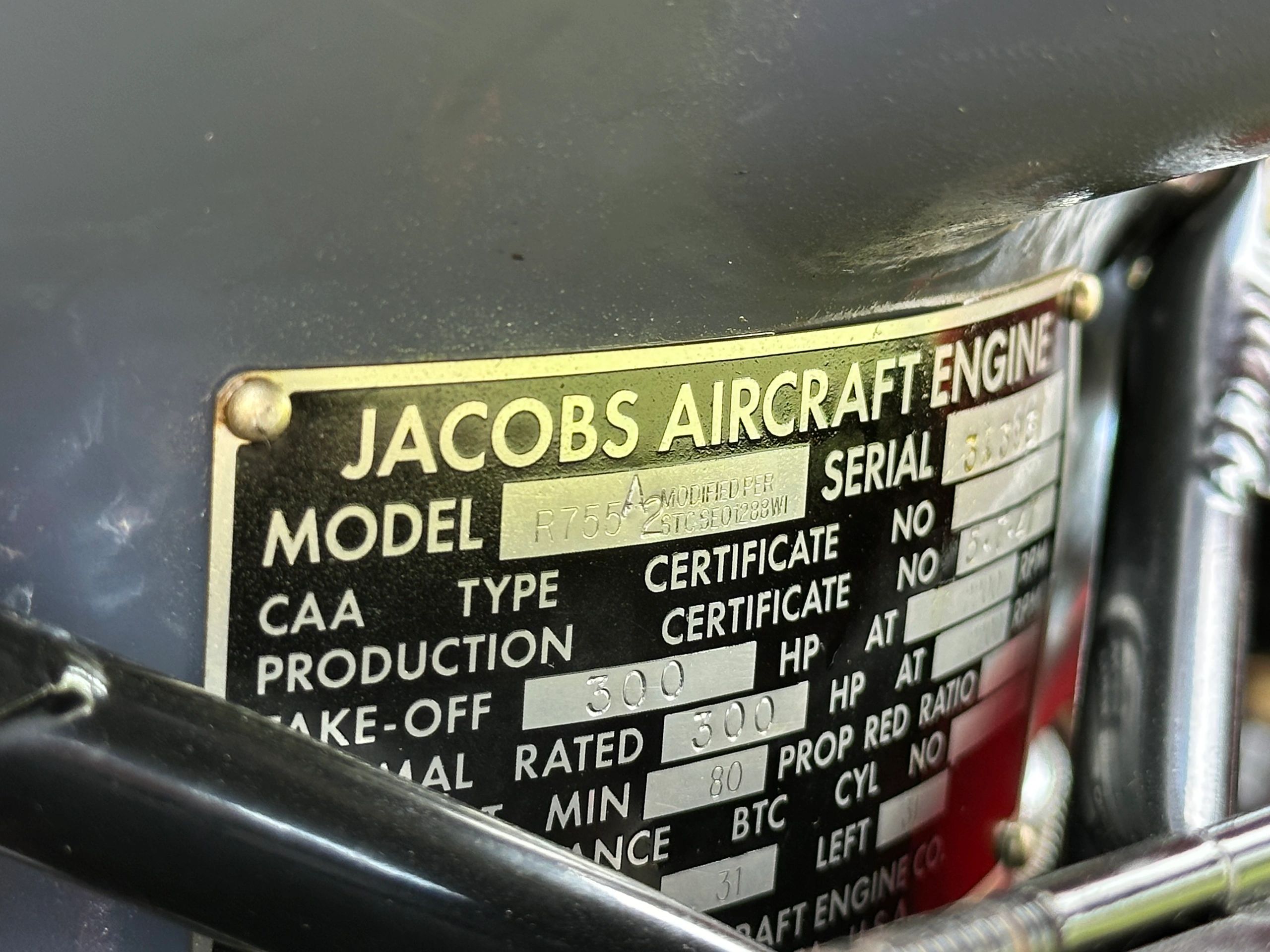 Close-up of a Jacobs Aircraft Engine information plate.