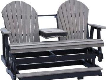 A double Adirondack chair with a small table in the middle.