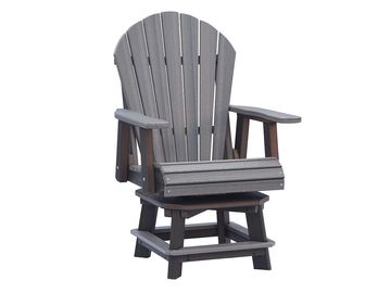 A classic gray Adirondack chair with armrests and a footrest.