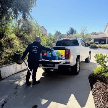 Pool service truck unloading chemicals and equipment