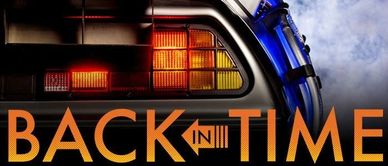 Close-up of DeLorean car tail light with 'Back in Time' text from Back to the Future.
