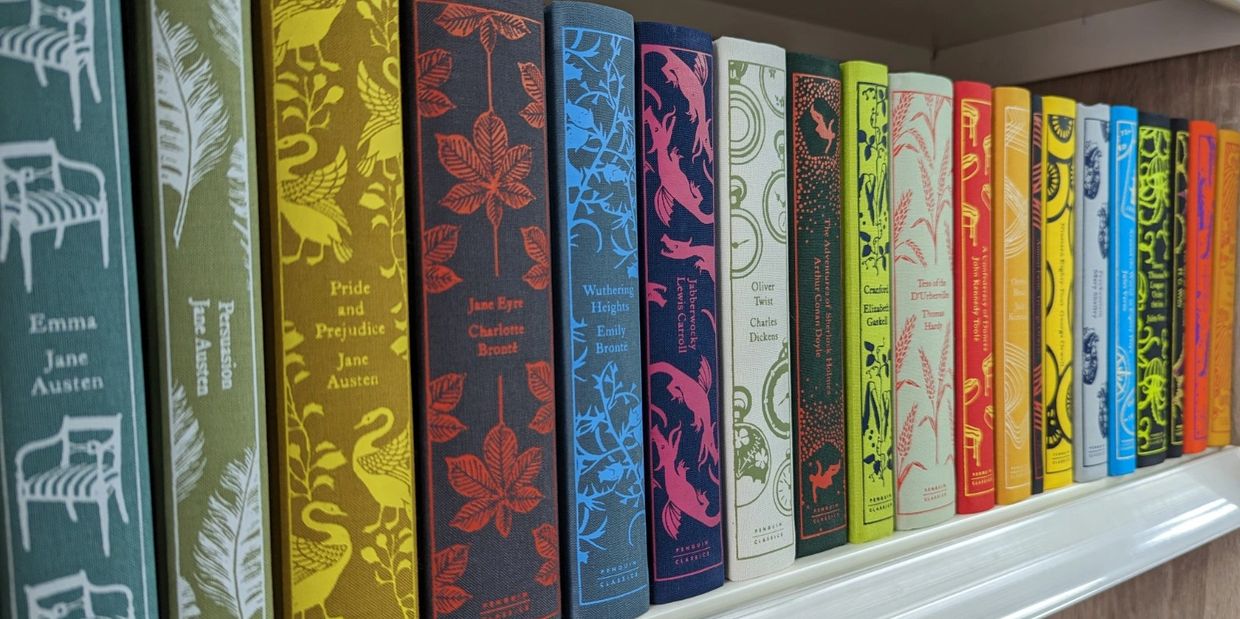 Row of Penguin Clothbound Classics books on shelf