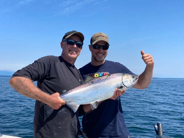 Two happy anglers with a great catch on Wildside Sportfishing Adventures boat.