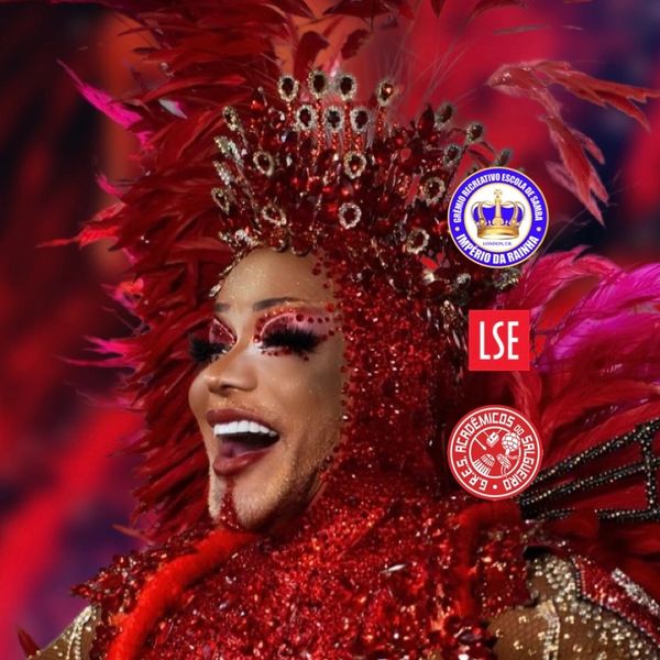 Person in an elaborate red carnival costume with feathers and sparkling details.