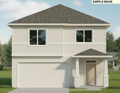 Modern two-story house with a gray roof and white exterior.