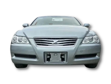 Front view of a silver car with a distinctive grille and headlights.