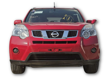 Front view of a red Nissan SUV with distinct headlights and grille.