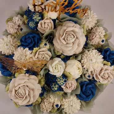 Elegant combination of floral buttercream cupcakes arranged on a platter board
