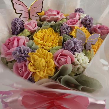 Beautiful bright buttercream flowers on  cupcakes. Cupcake bouquet