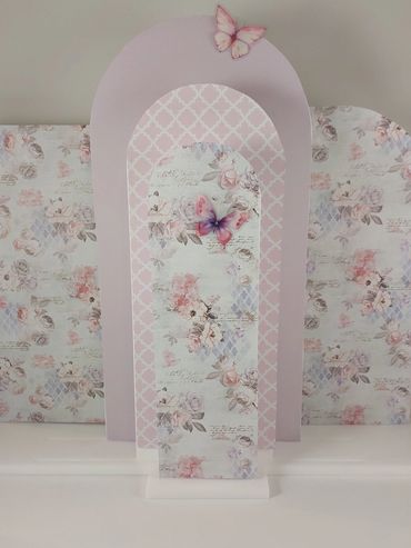 Elegant, floral-themed decorative panels with butterfly accents in soft pastel colors.