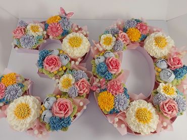 Floral cake shaped as the number 30.