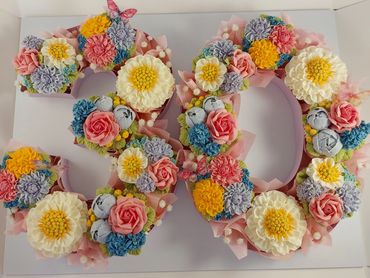 Decorative floral arrangement forming the number 50.