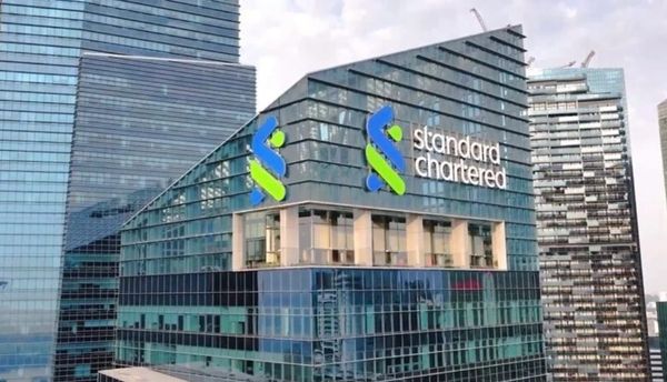 Standard Chartered building in a cityscape.