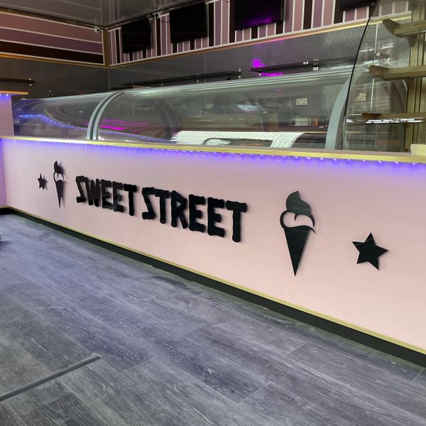 cut acrylic lettering in sweet shop