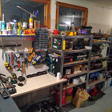 Organized workshop with tools and shelves.
