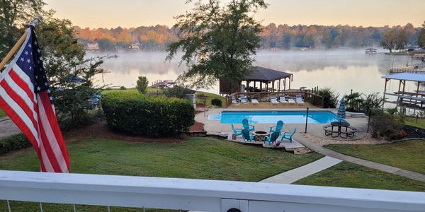 View form deck of pool, dock and lake at our Lake Sinclair retreat - vacation rental in Georgia