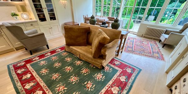 Armchairs and rugs were cleaned in the sitting room.