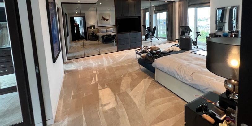Carpet cleaning in Chelsea apartment with a professional carpet cleaning machine.