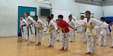 students bowing to instructor showing respect and discipline