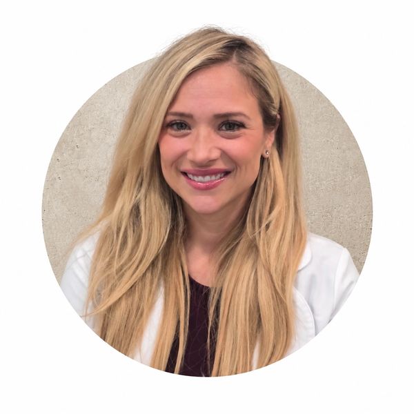 Smiling woman with long blonde hair.