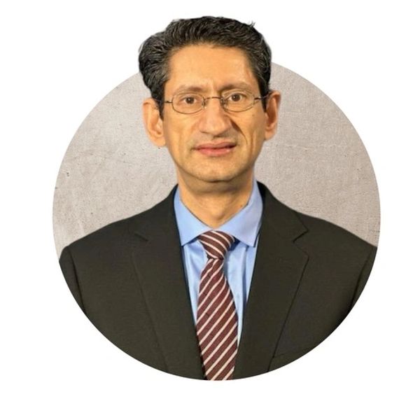 Professional man in suit and glasses.