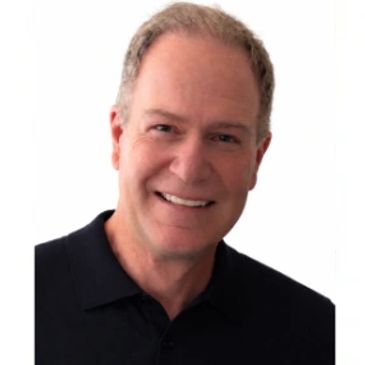 Smiling middle-aged man in a black polo shirt against a white background.