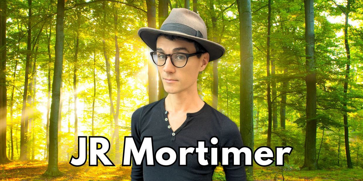 RevolutionTV creator JR Mortimer standing in forest