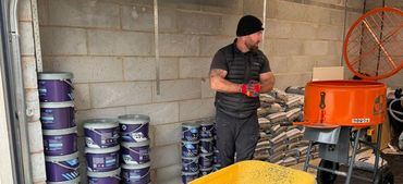 A garage holding all the materials for the resin driveway.