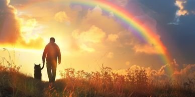 <img src="image.jpg" alt="Silhouette of man and talk walking in meadow toward rainbow">​ 
