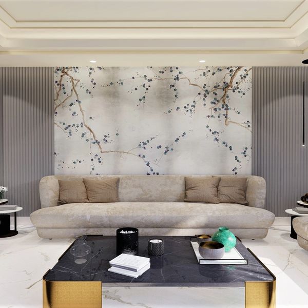 Elegant living room with a beige sofa and artistic wall mural.