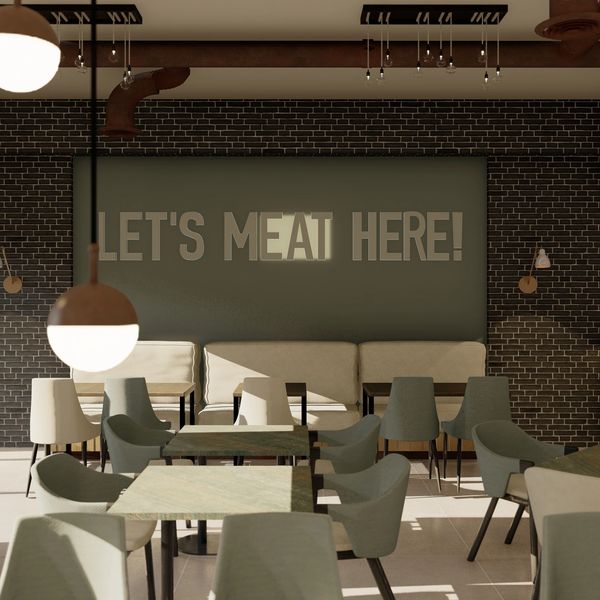 Modern restaurant interior with a humorous meat-themed sign on the wall.